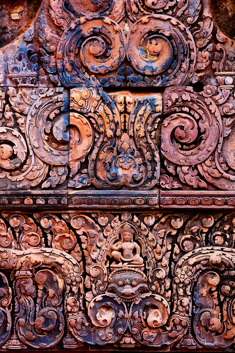 Remarkably preserved detailed carvings in pink sandstone at Banteay Srei temple in Angkor