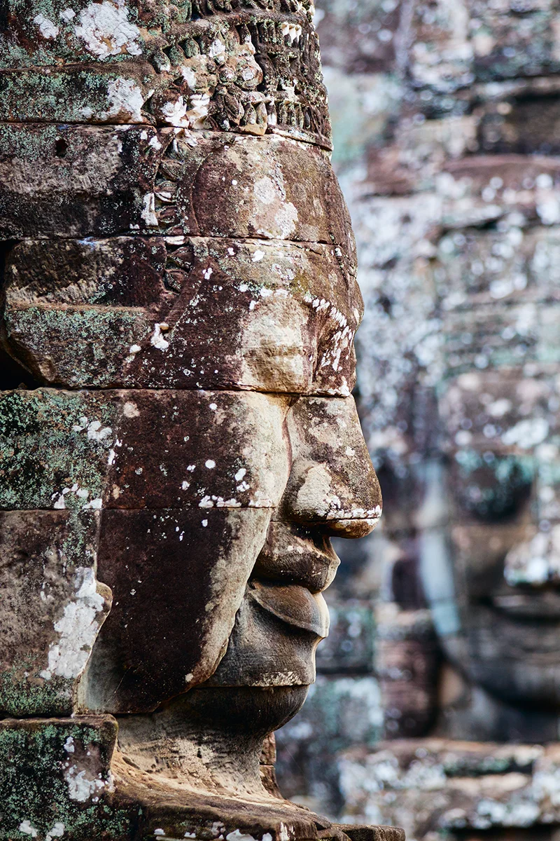 Bayon temple iconic smiling stone faces in Angkor complex in Cambodia