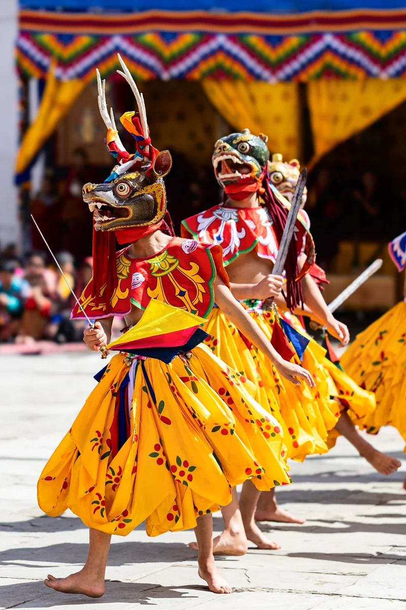 Traditional mask dance at Gangtey Tshechu festival in Bhutan