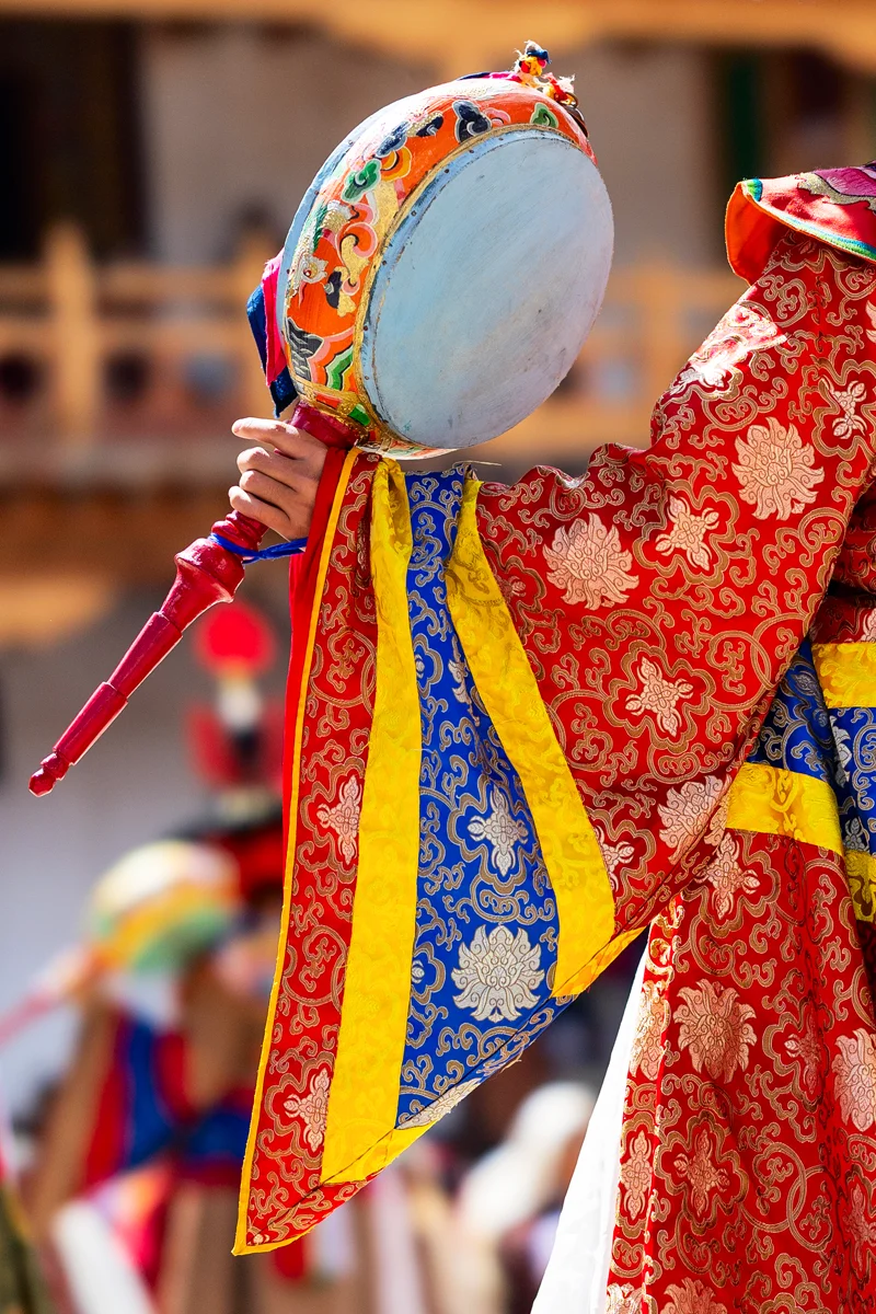 Colorful costume details of a Bhutan festival performer