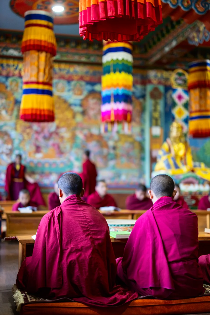 Buddhist monks performing ceremony in a temple