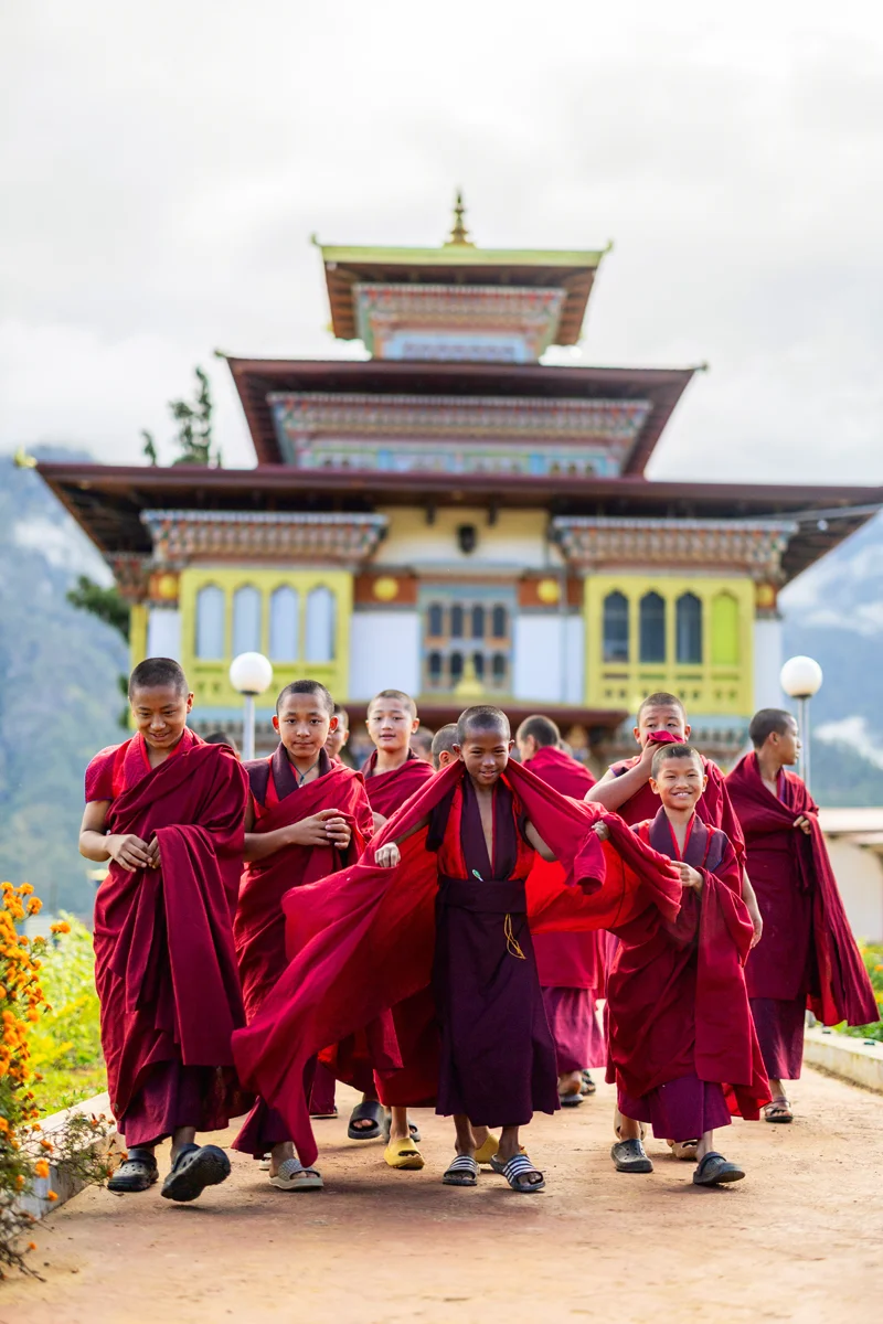 Young monks in front of a small temple in Bhutan