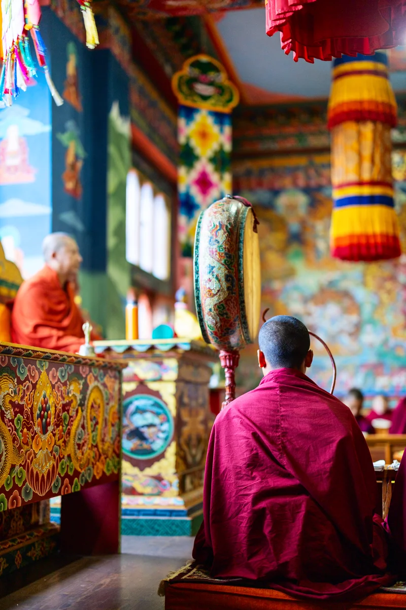 Monks performing a Buddhist ceremony in a temple