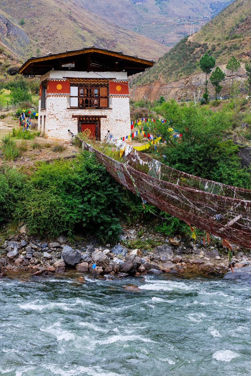 Tachog Lhakhang suspension bridge adorned with colorful prayer flags
