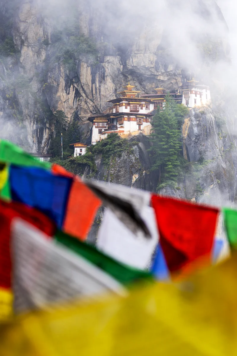 Buddhist Tiger's Nest monastery amidst colorful prayer flags