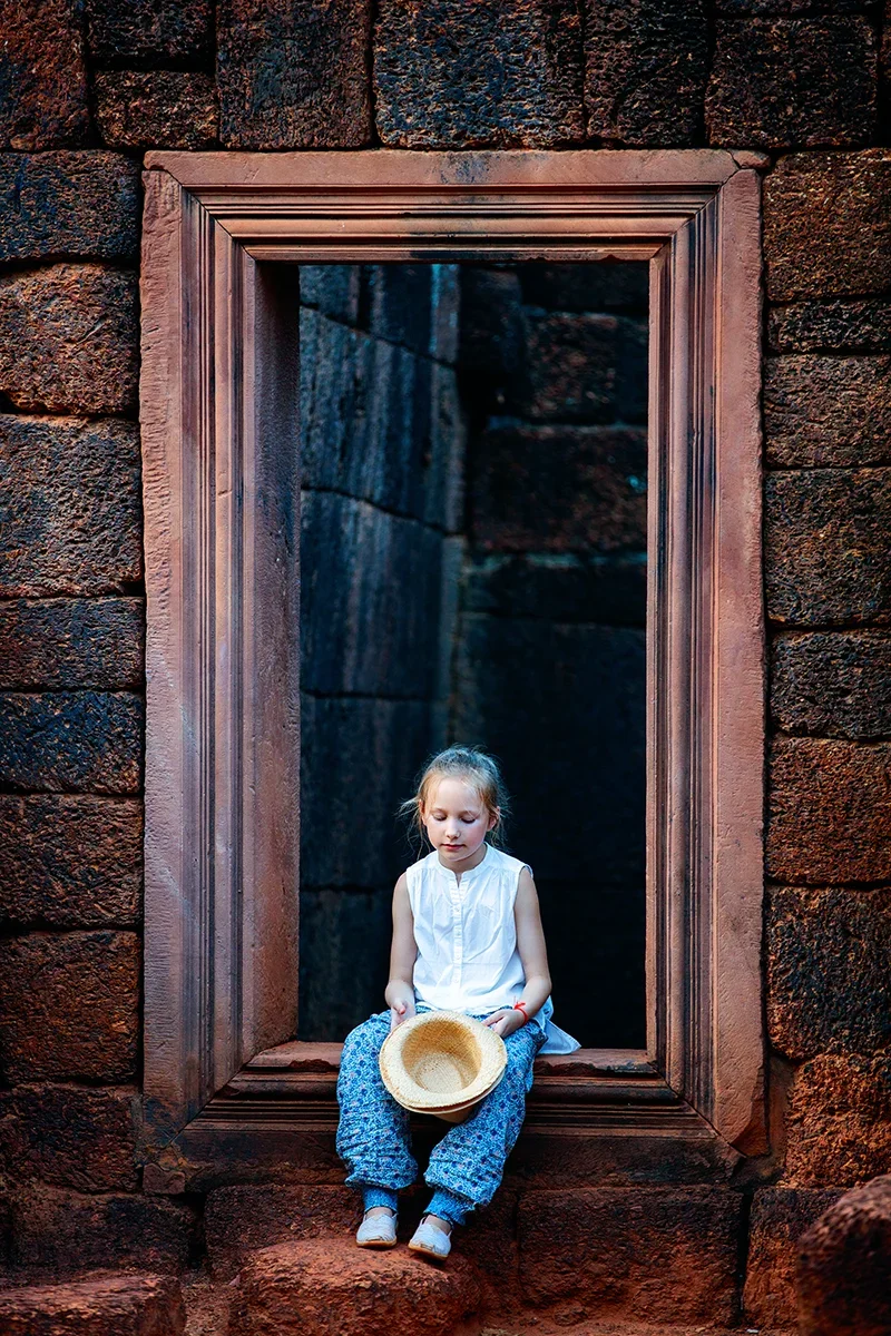 Child at Banteay Srei temple in Cambodia