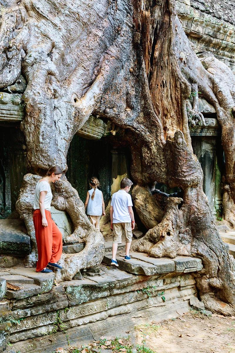 Family exploring Preah Khan Angkor temple in Siem Reap during their Cambodia itinerary