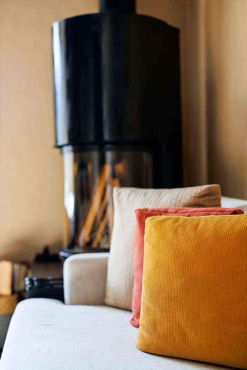 Cozy sofa with colorful cushions.