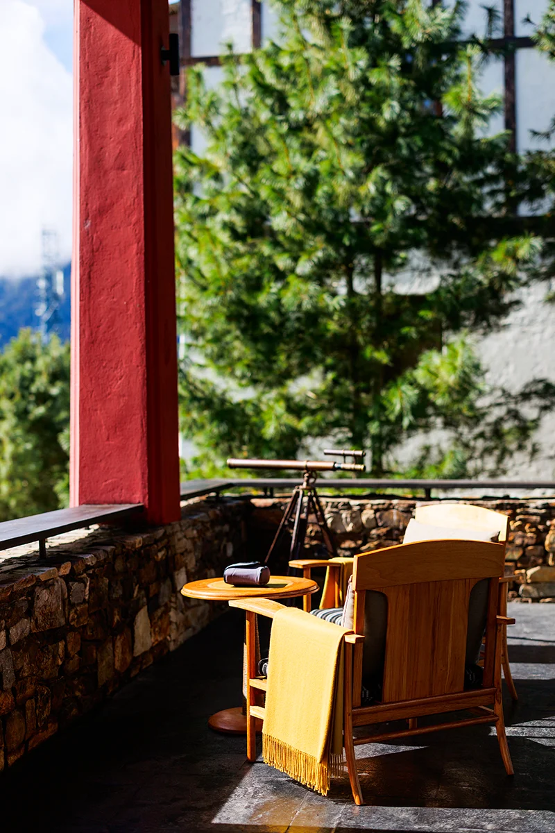 Cozy outdoor seating with scenic view at Gangtey Lodge in Bhutan
