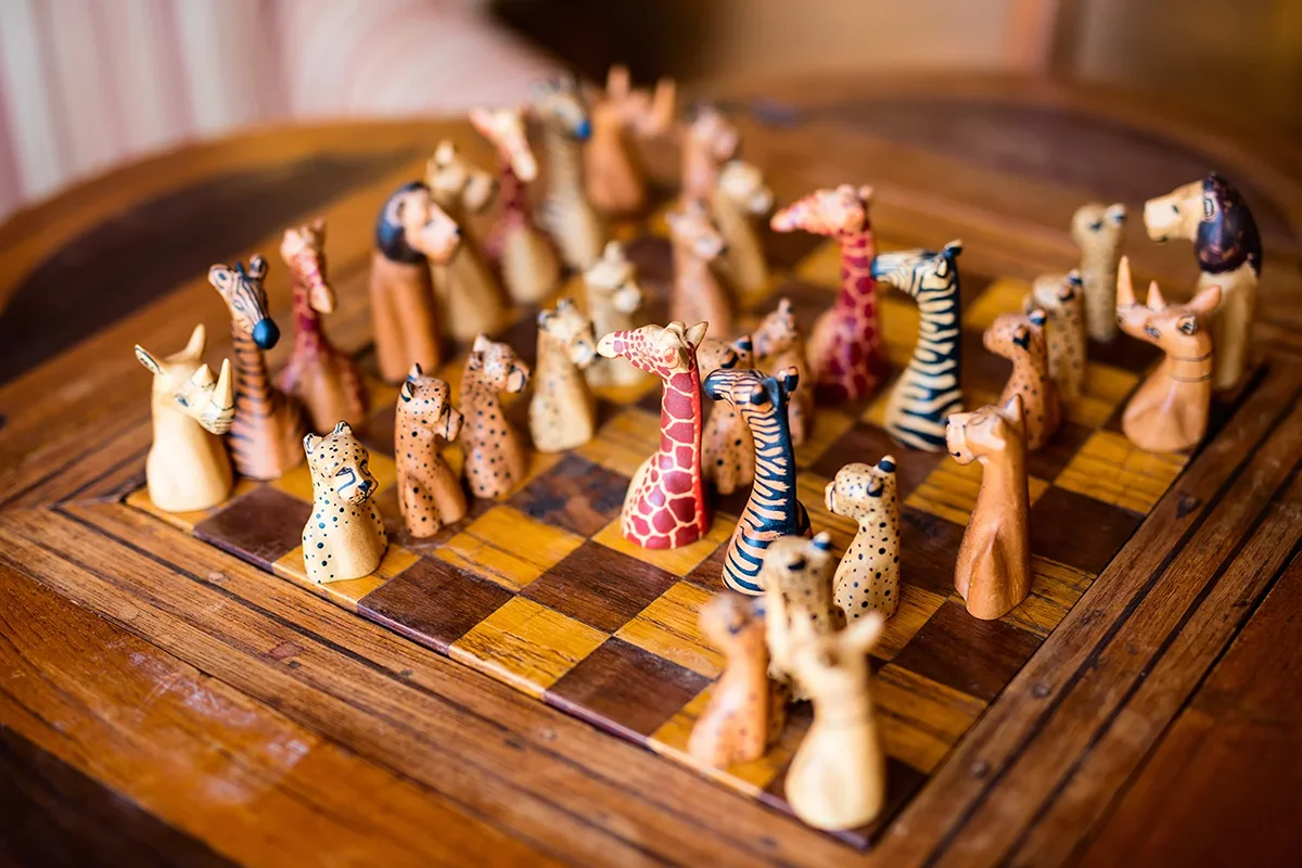 Unique chess board featuring custom pieces shaped like giraffes and other African wildlife at Giraffe Manor hotel in Kenya
