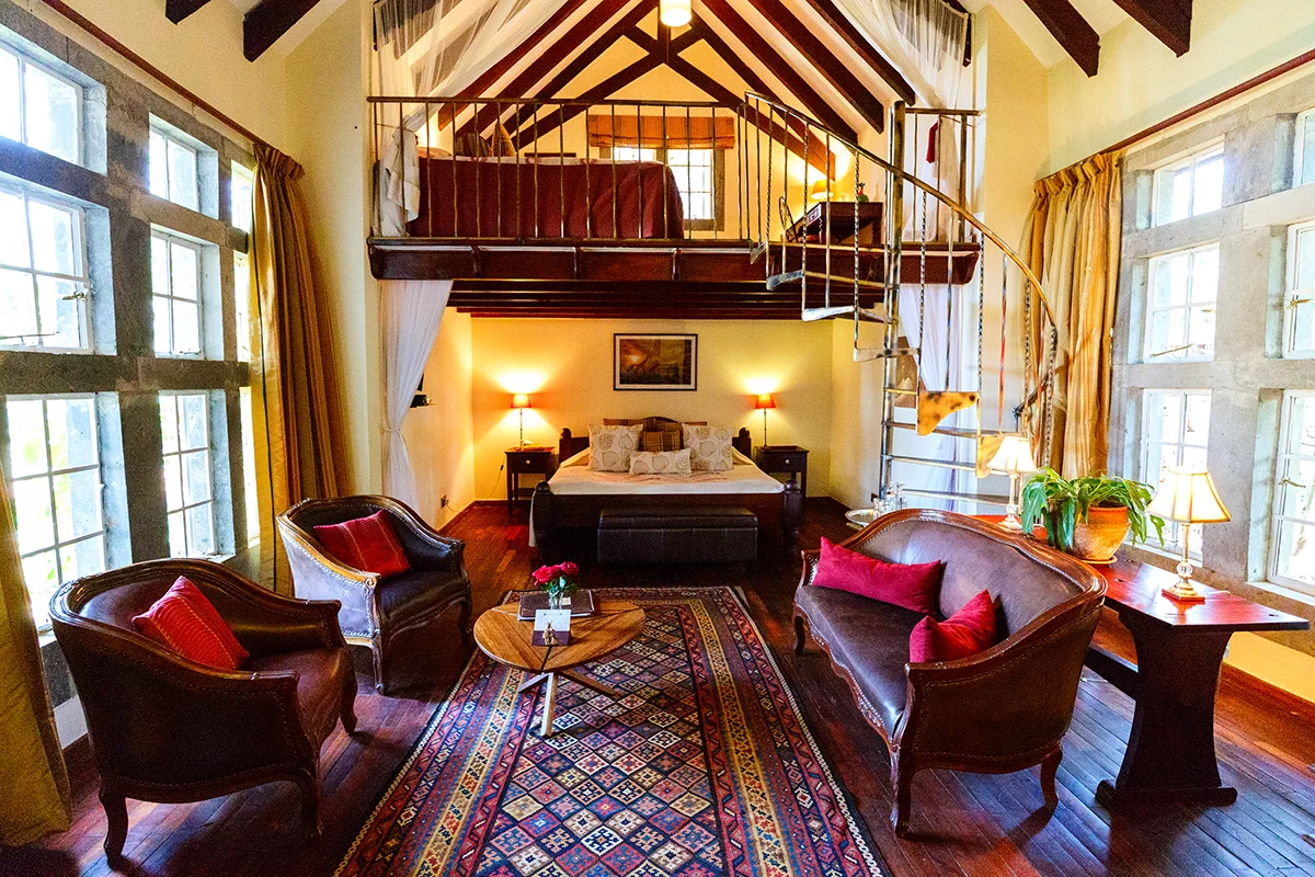Spacious room interior of the Finch Hatton Suite at Garden Manor hotel in Kenya showcasing stylish furnishings
