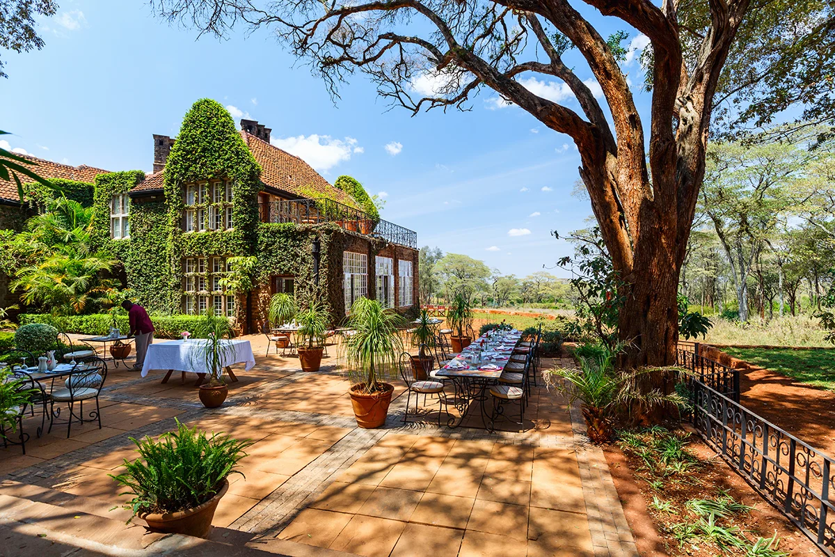 Exterior of historic Giraffe Manor house in Kenya showing its distinctive stone architecture and colonial-style design
