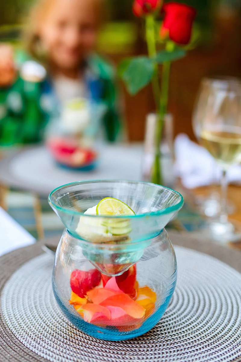 Artisanal ice cream dessert decorated with delicate rose petals served for lunch at Giraffe Manor hotel in Kenya