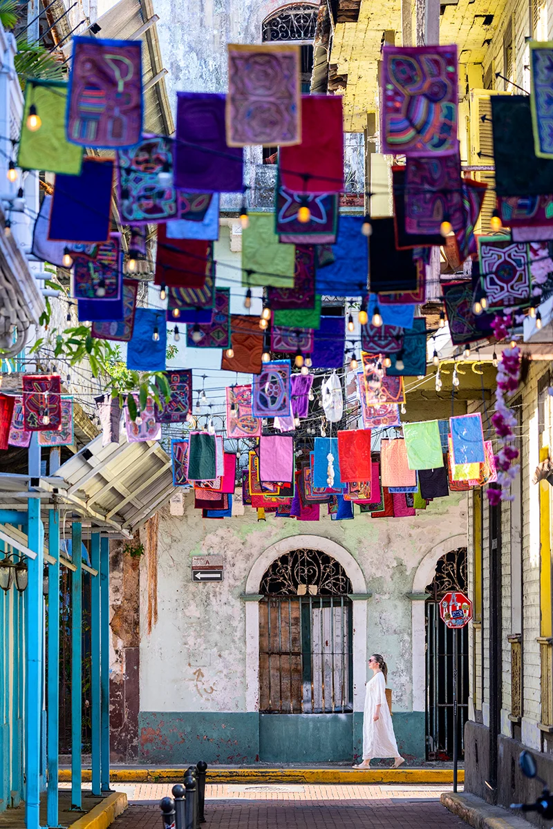 Colorful molas in a vibrant alley of Casco Viejo