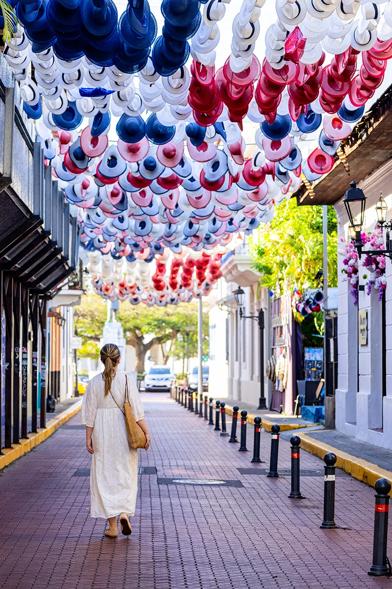 Colorful hats hanging over street