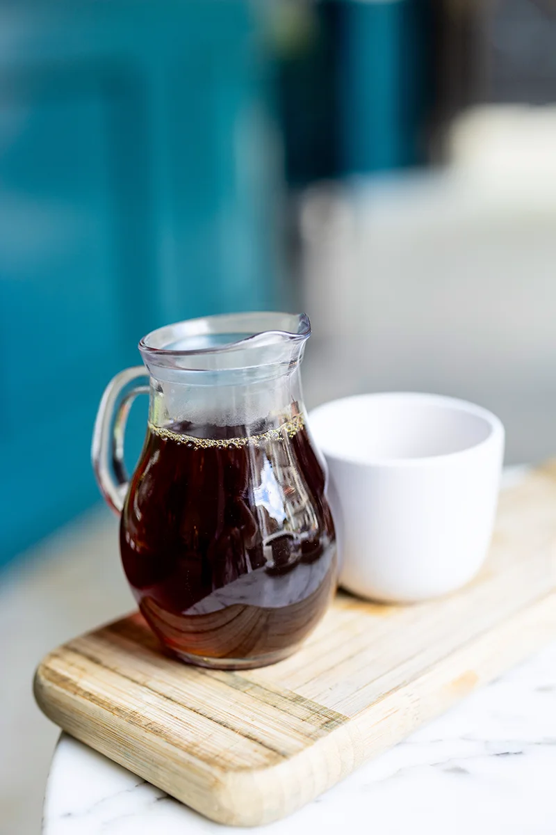 Coffee pitcher and cup on tray