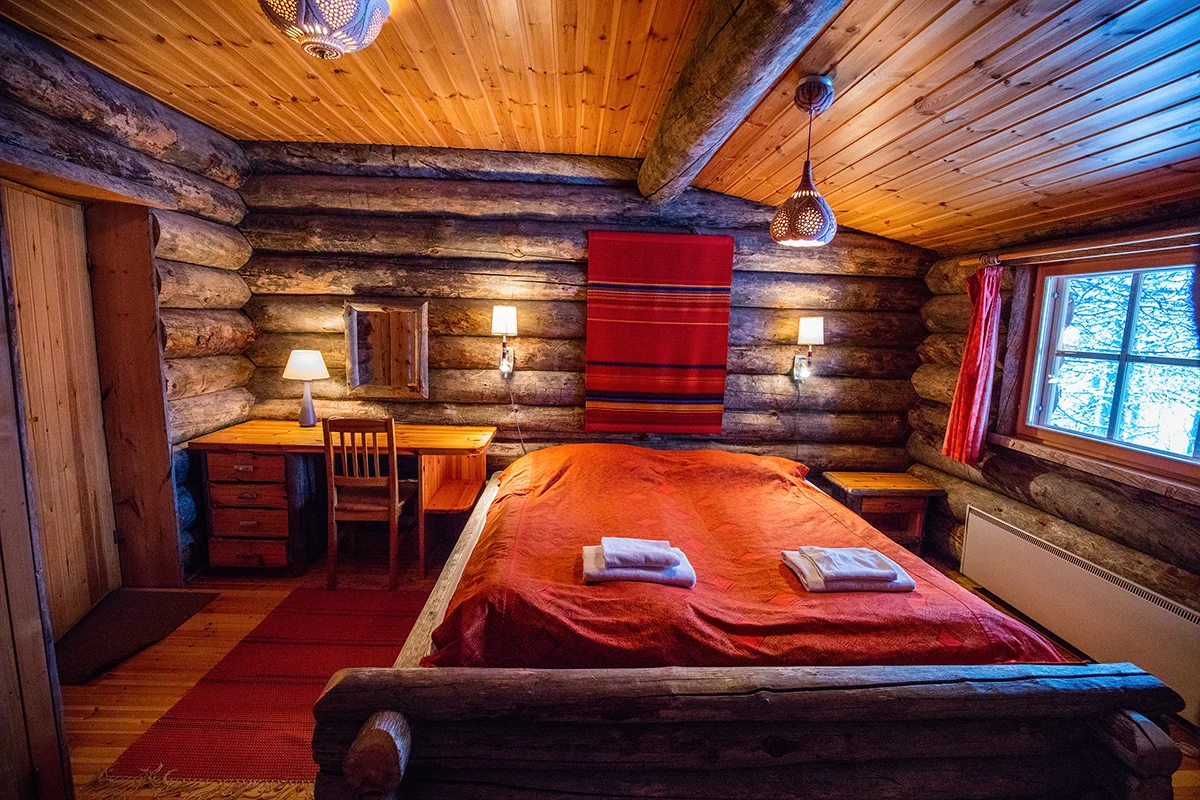 Cozy interior of log cabin in Kakslauttanen Arctic Resort in Finland