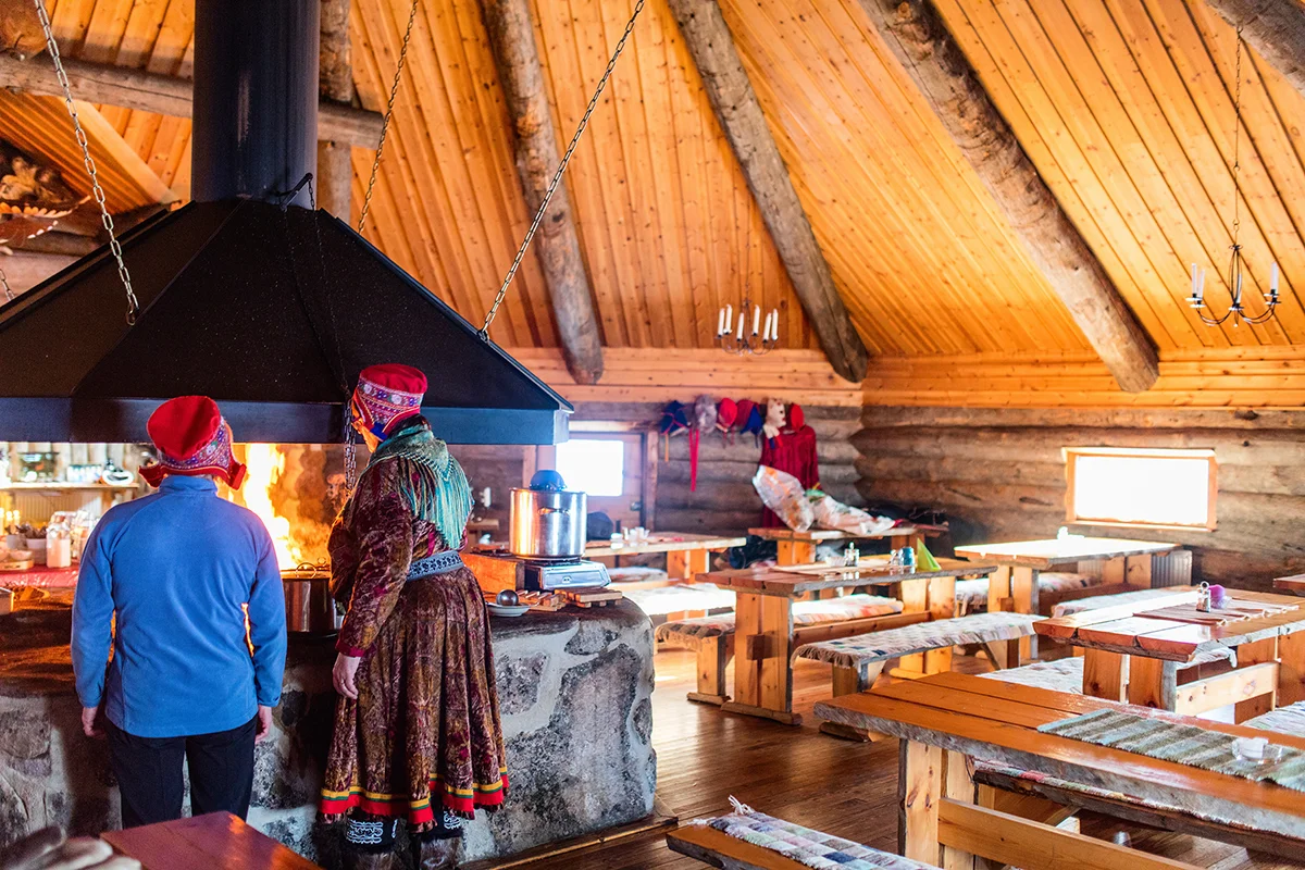 Cozy local restaurant with rustic wooden furniture in Finnish Lapland