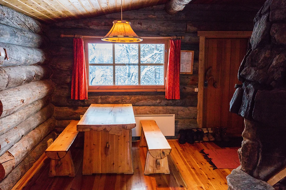 Cozy interior of log cabin in Kakslauttanen Arctic Resort in Finland