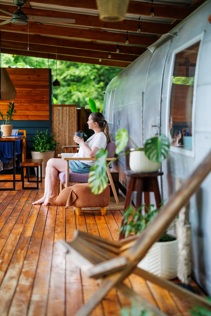 Woman drinking coffee at La Caravana hotel in Costa Rica