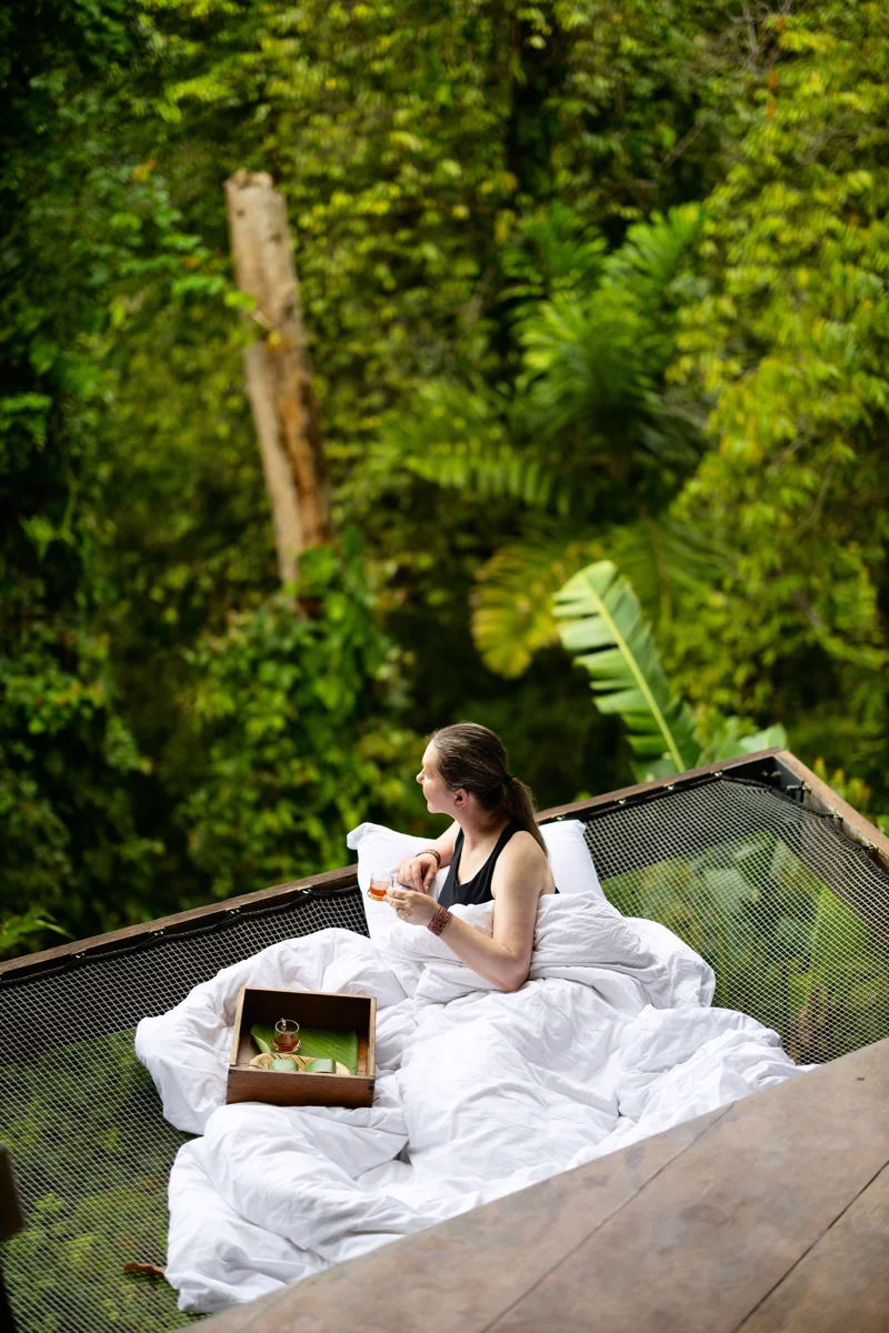 Relaxing in a hummock at La Loma Jungle Lodge with morning cacao tea