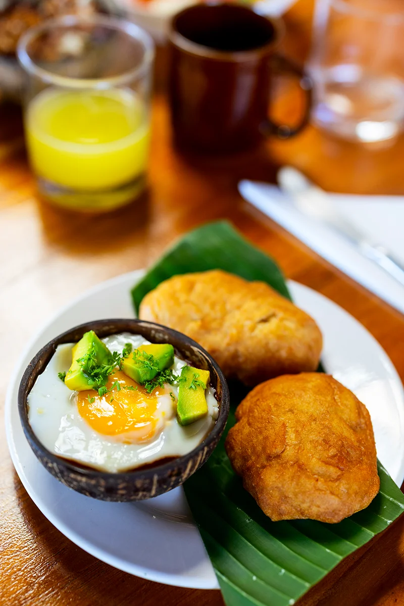 Breakfast with eggs and fried pastries
