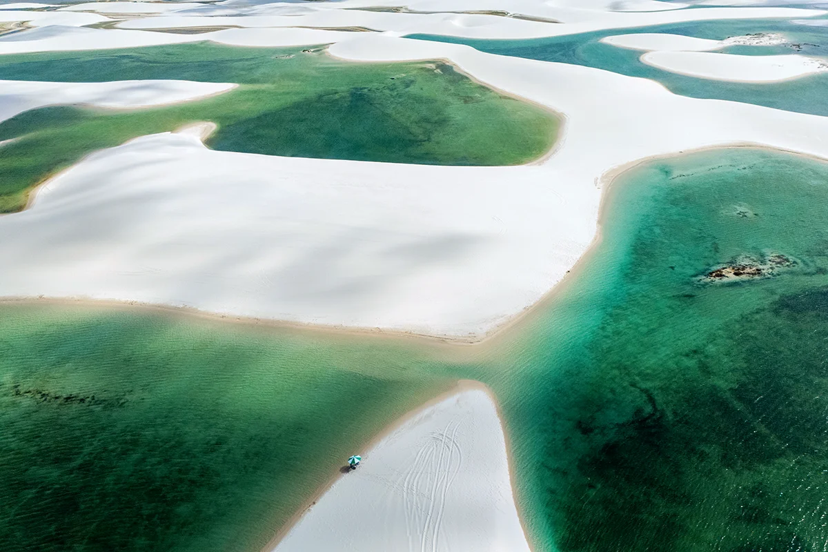 White sand dunes with turquoise water in Ponta Verde Circuit near Santo Amaro