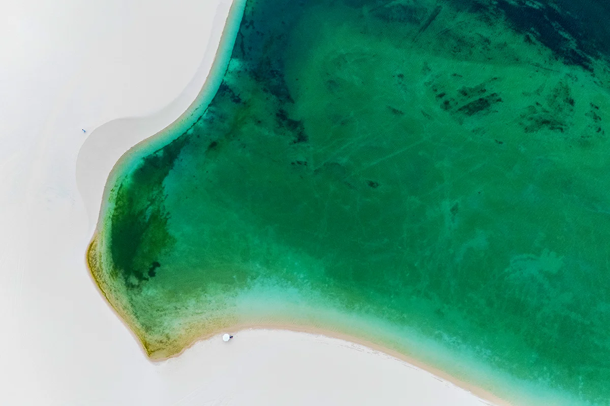 Aerial view of turquoise water and sand dunes in Lençóis Maranhenses