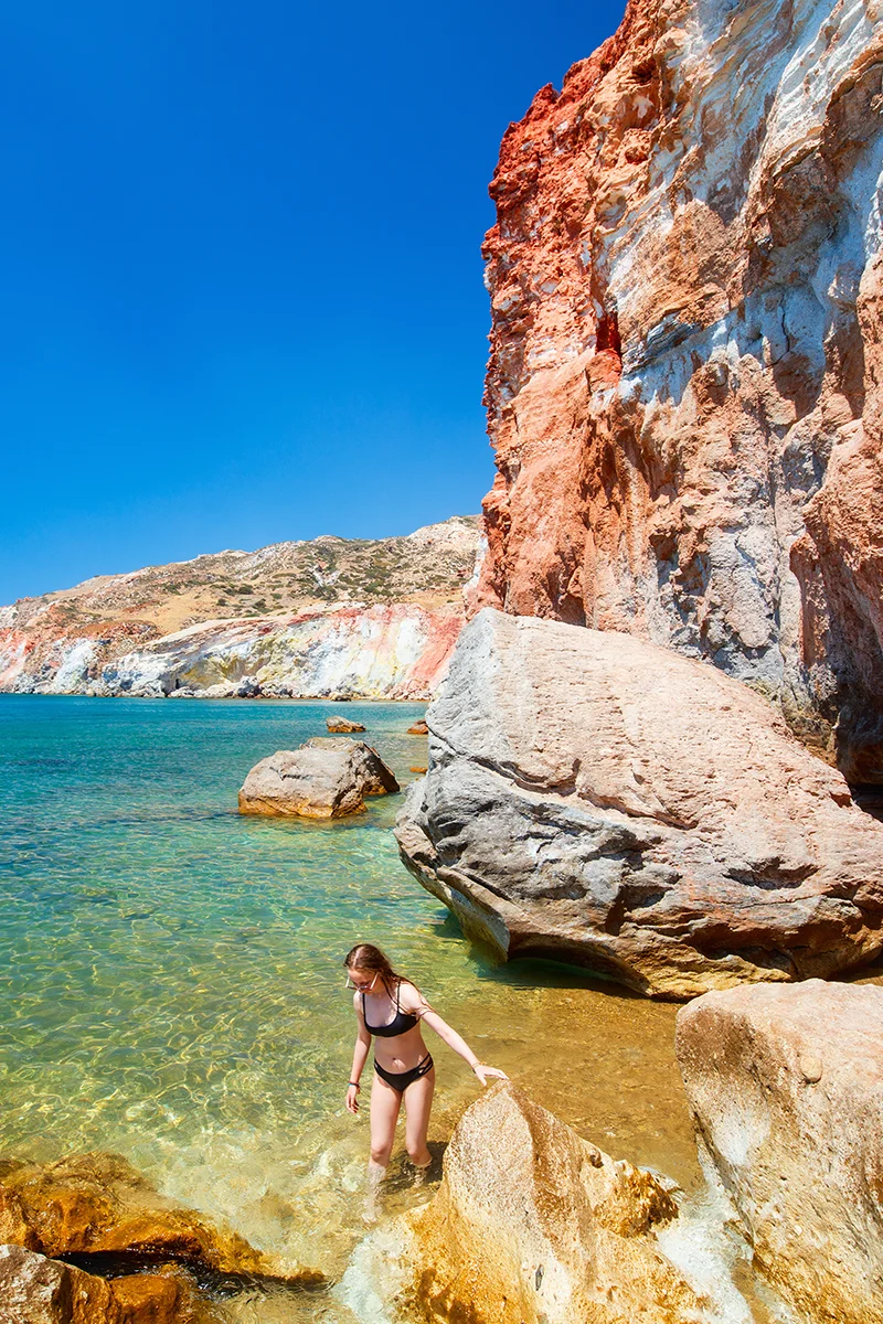Red cliffs of Paleochori Beach in Milos