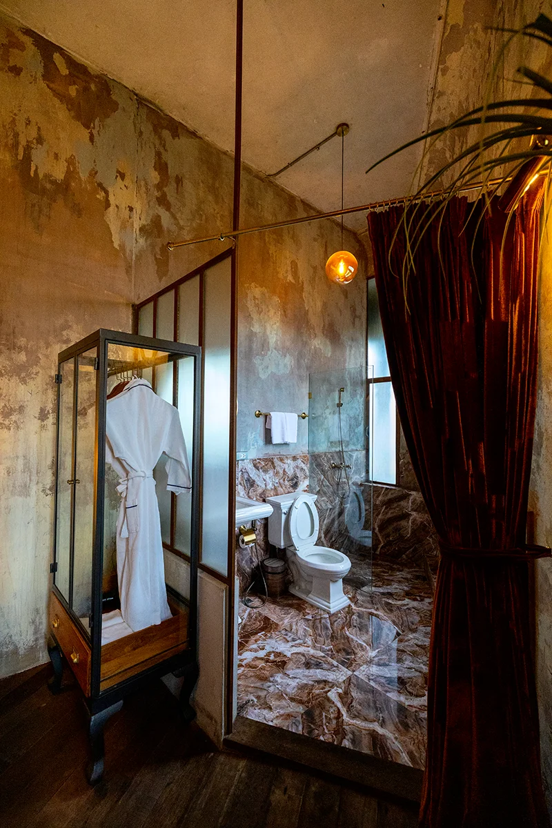 Rustic bathroom with modern features in The Mustang Blu boutique hotel in Bangkok