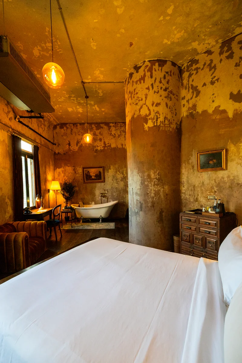 Rustic room with vintage decor in The Mustang Blu boutique hotel in Bangkok Thailand