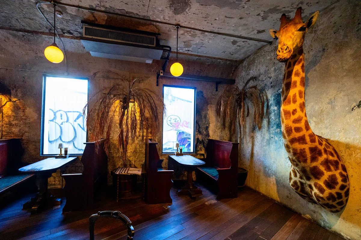 Giraffe head mounted in restaurant in The Mustang Blu