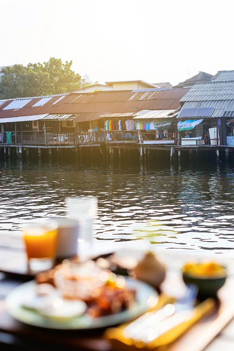 Breakfast served on the patio overlooking the canal in Bangkok