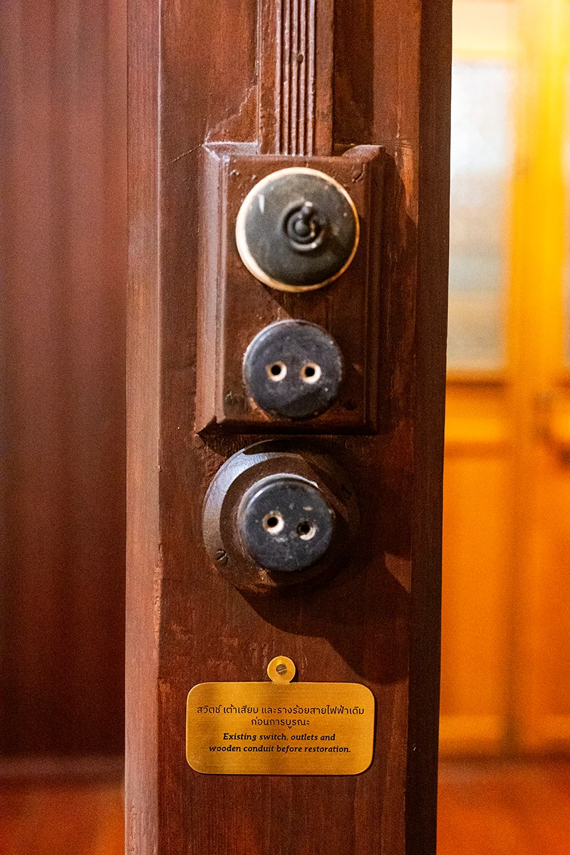 Old electrical outlets on wooden post