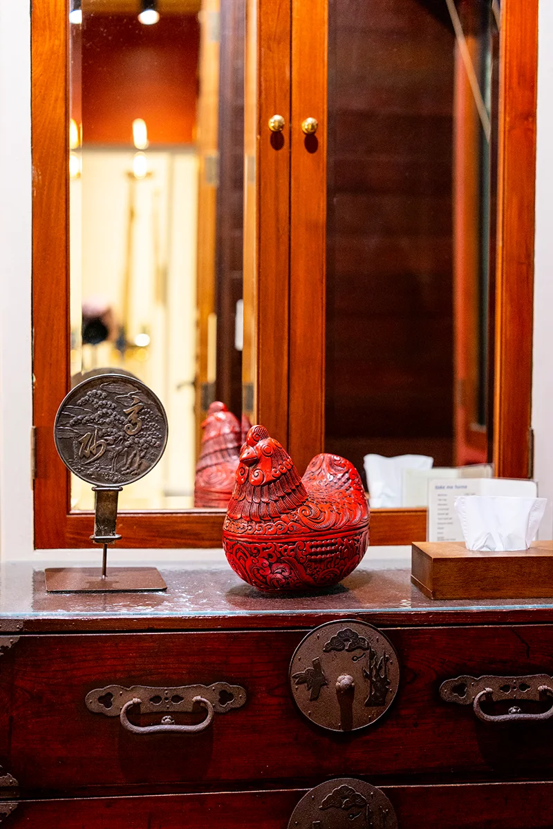 Decorative items on wooden dresser