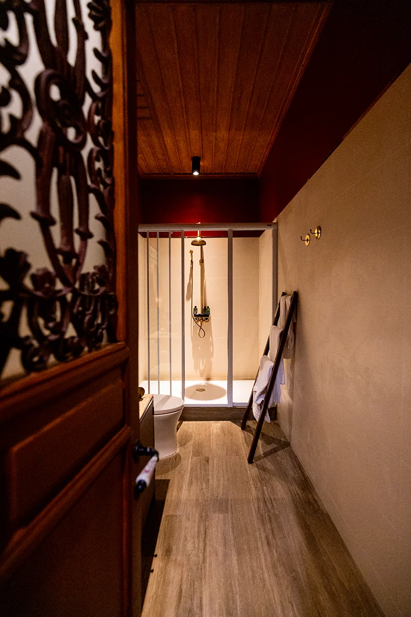 Modern bathroom with shower area at Neil Niwas hotel in Bangkok