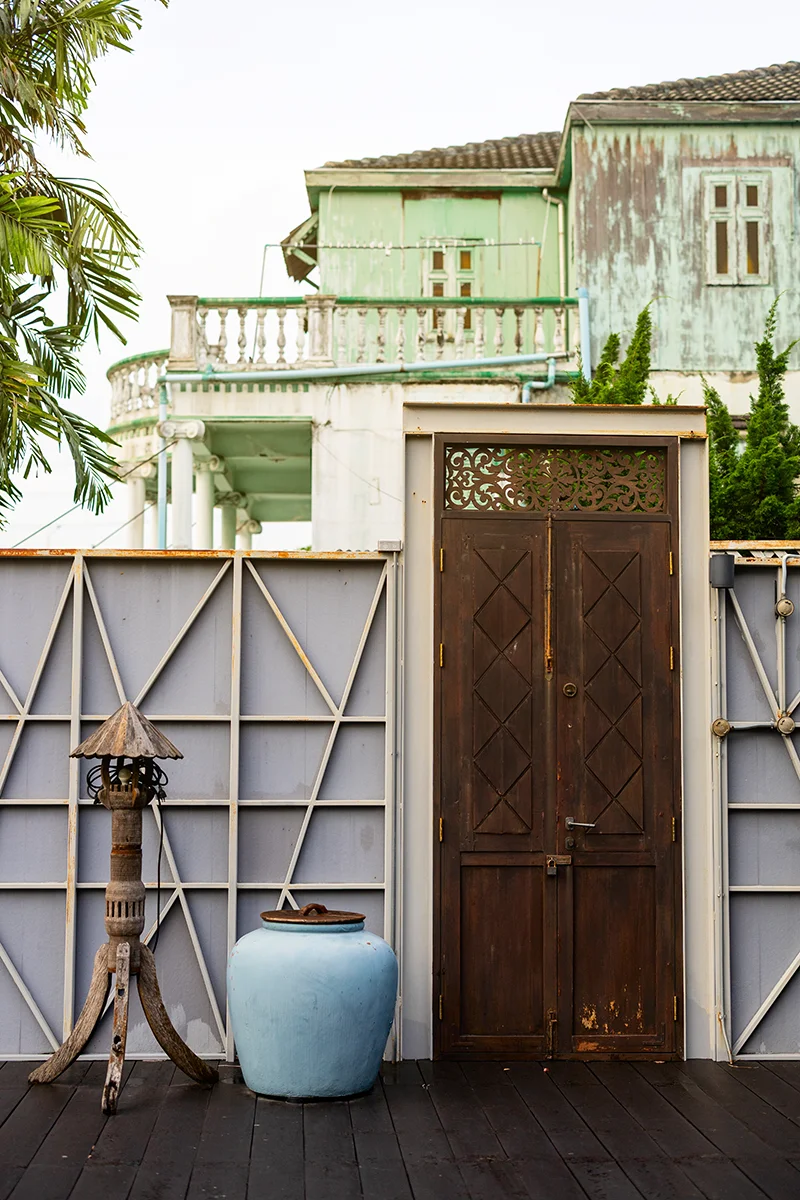 Rustic door with green building backdrop