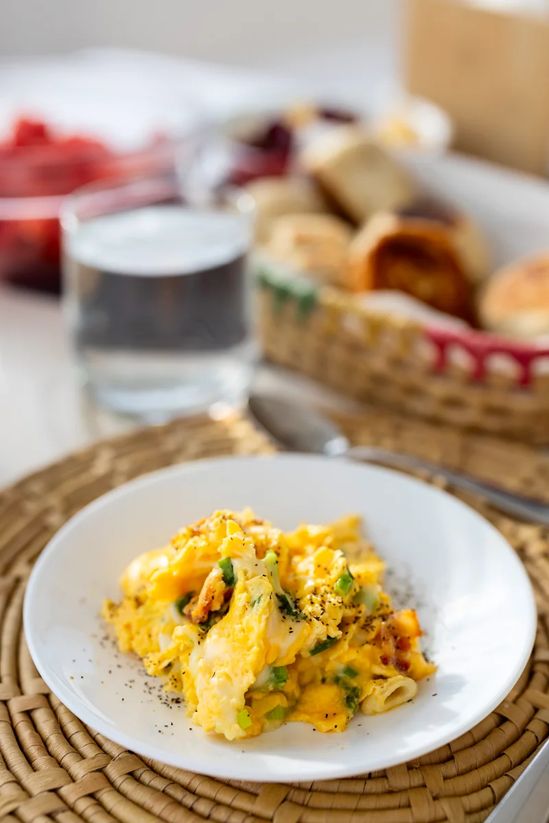 Plate of scrambled eggs with vegetables