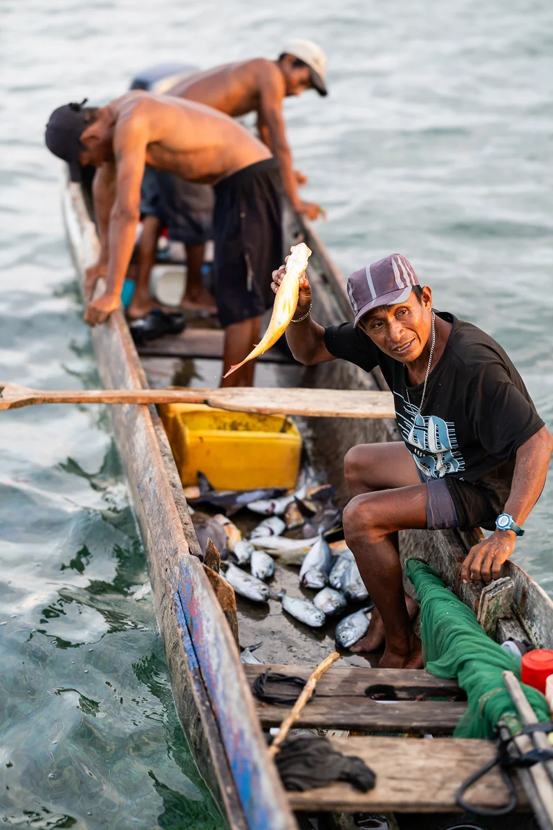 Guna fishermen on a boat catching fish