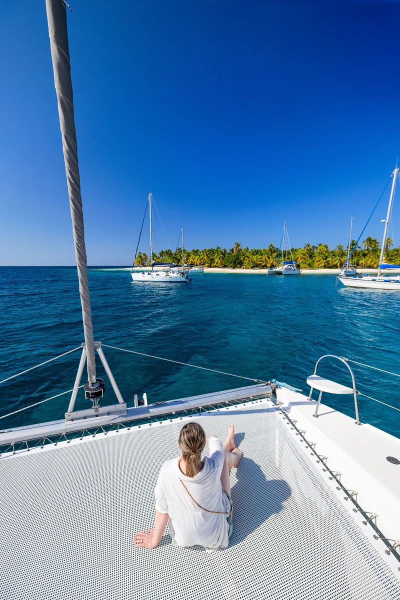 Woman relaxing on a catamaran in the San Blas Islands