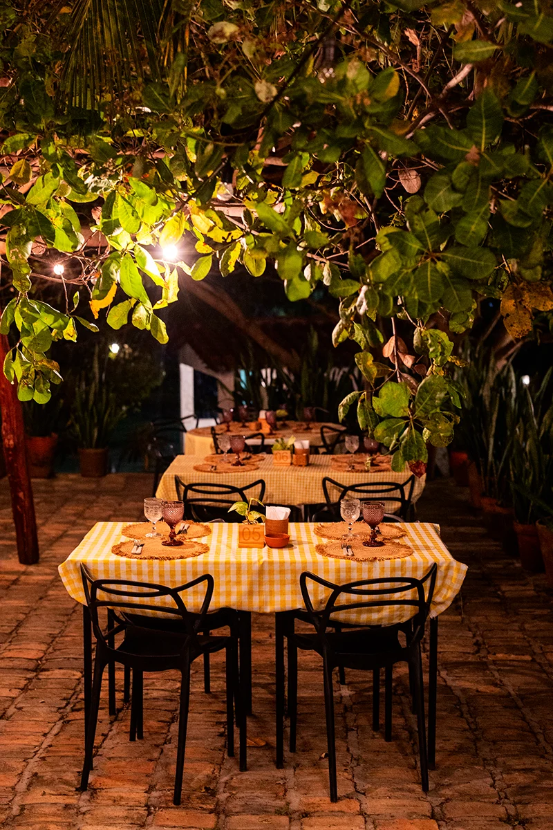 Cozy outdoor dining with yellow tables