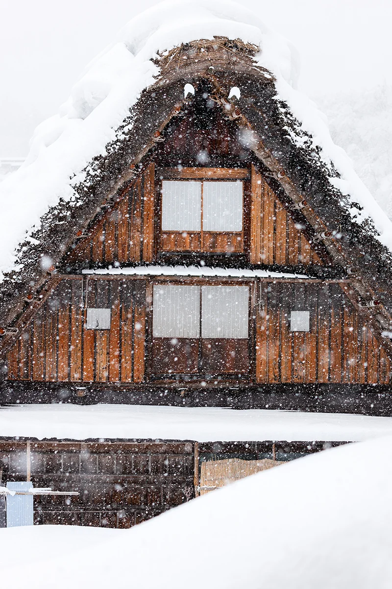 Snow-covered traditional Japanese farmhouse