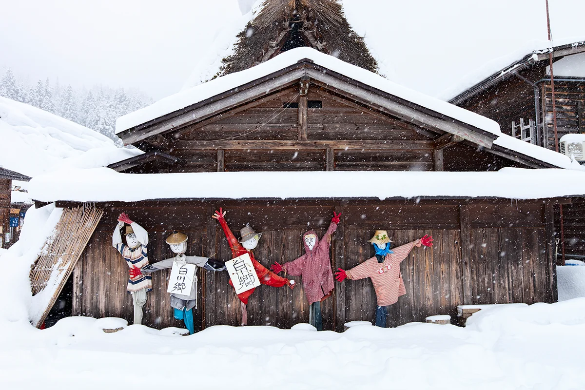 Scarecrows in snowy village setting in Shirakawa-go Japan