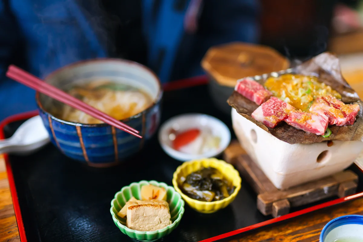 Japanese meal with grilled Hida beef and sides