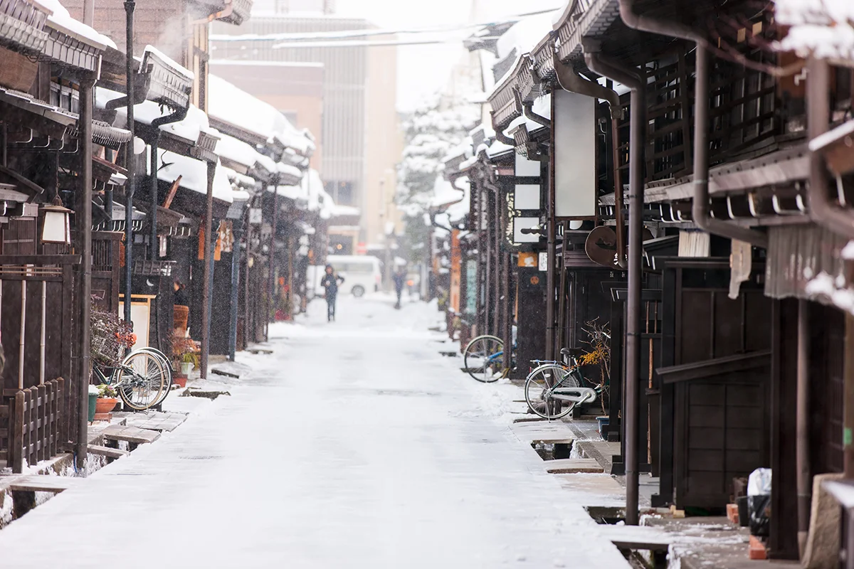 Snowy street with traditional buildings in Takayama Old Town
