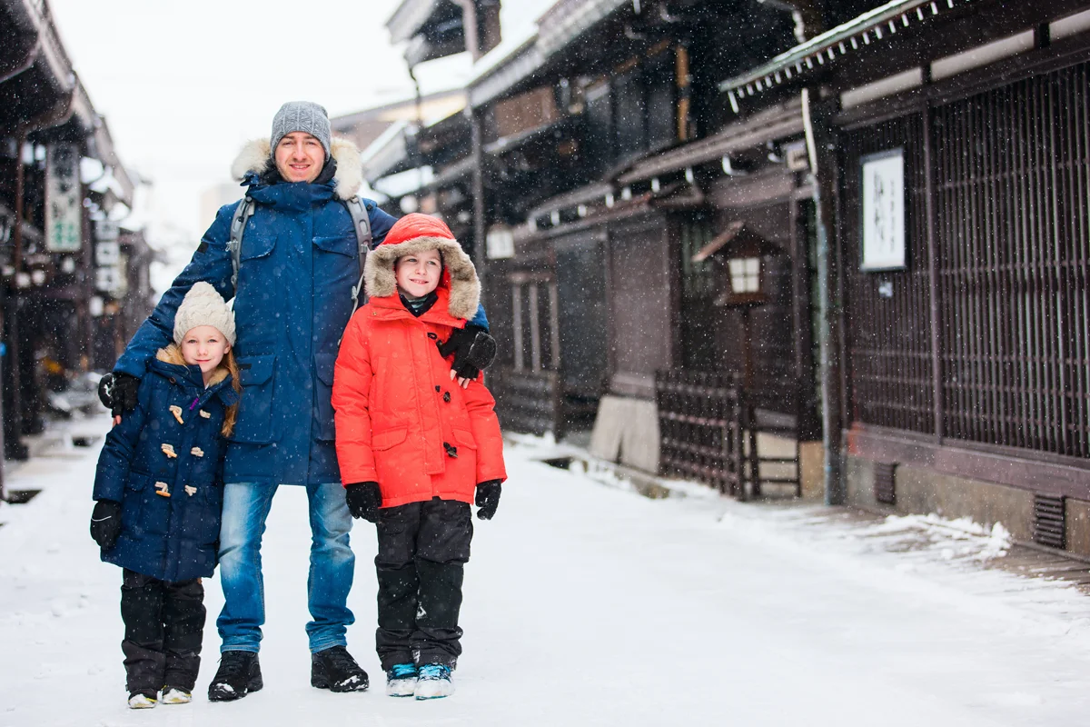 Family in Takayama Old Town on winter day