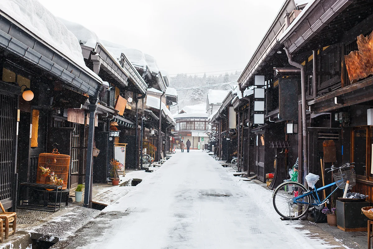 Snowy street with traditional buildings in Takayama Old Town