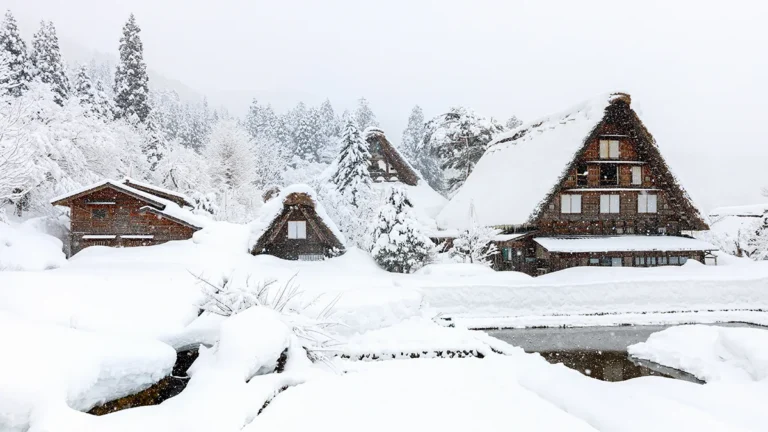 Snow-covered traditional Japanese farmhouses in Shirakawa-go village