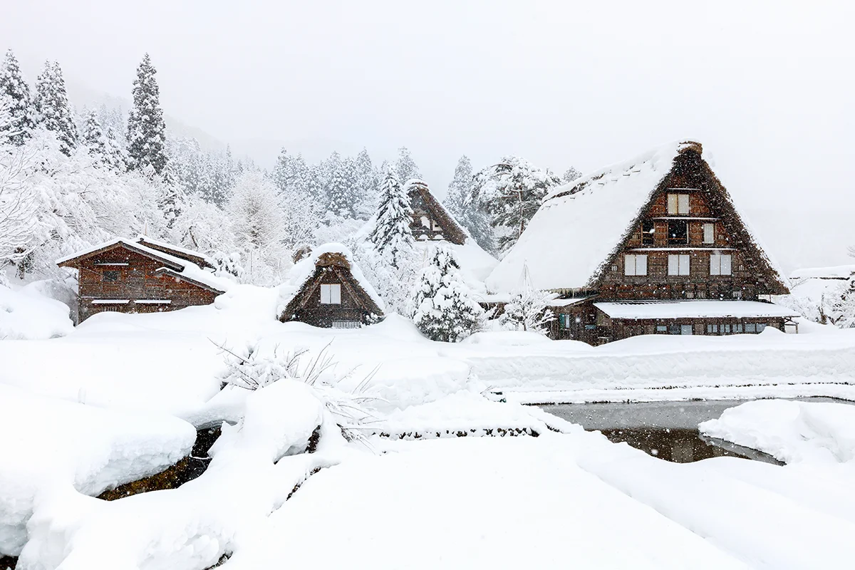 Snow-covered traditional Japanese farmhouses in Shirakawa-go village