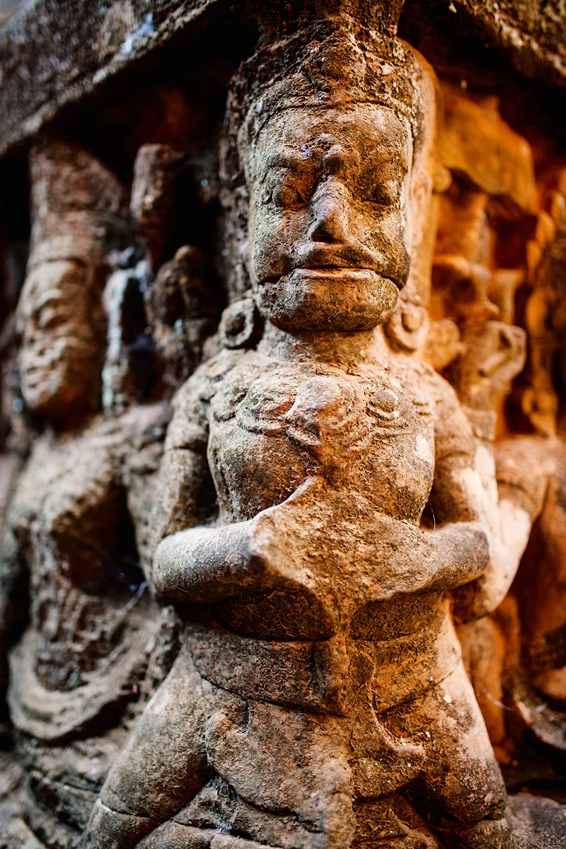 Walls of the Terrace of the Leper King in Angkor covered in remarkably well-preserved bas reliefs